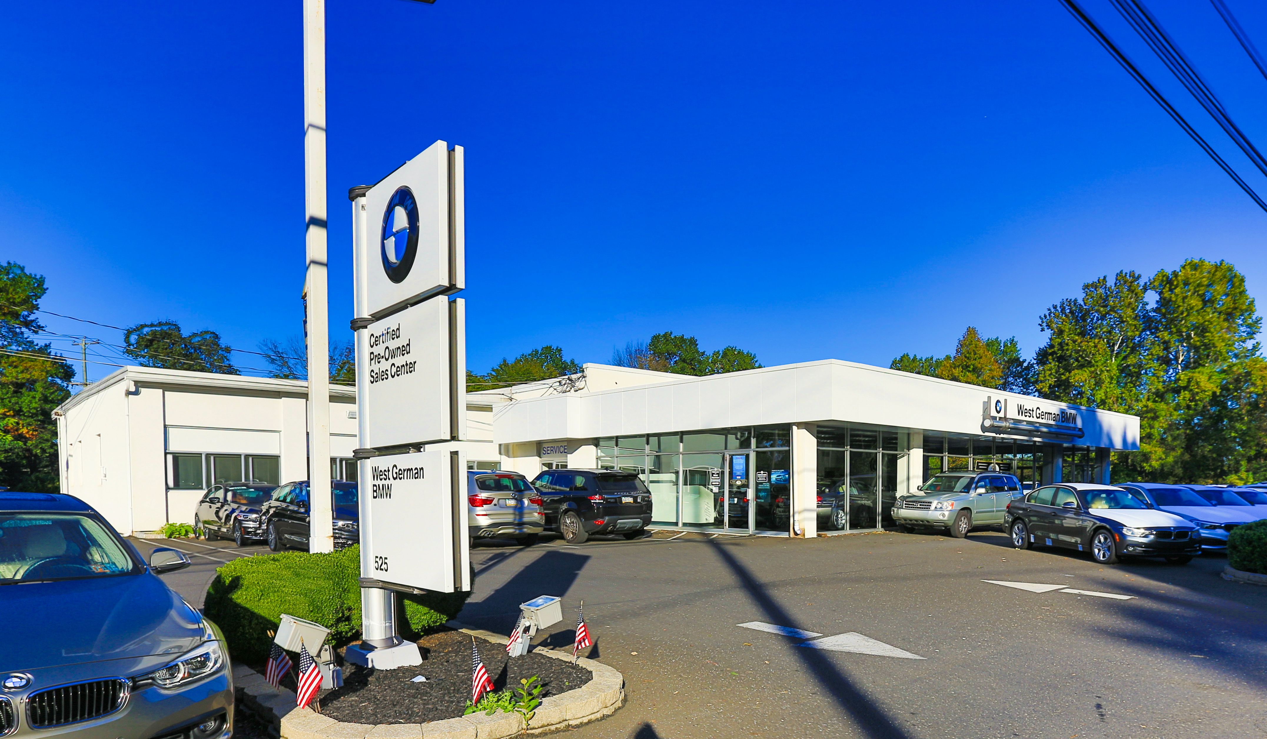 Picture of the outside of a BMW dealership lot